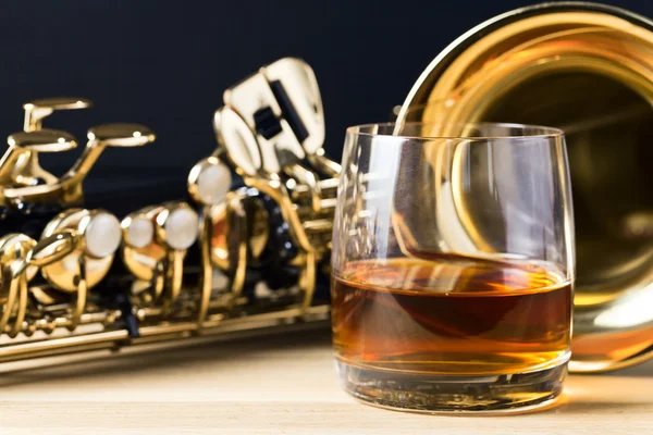 Saxophone and whiskey — Stock Photo, Image