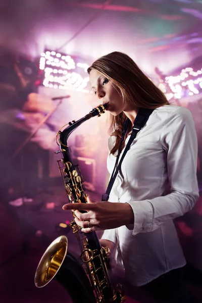 Young beautiful woman with saxophone — Stock Photo, Image