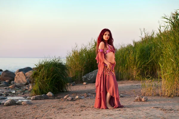 Girl in east dress on seacoast — Stock Photo, Image