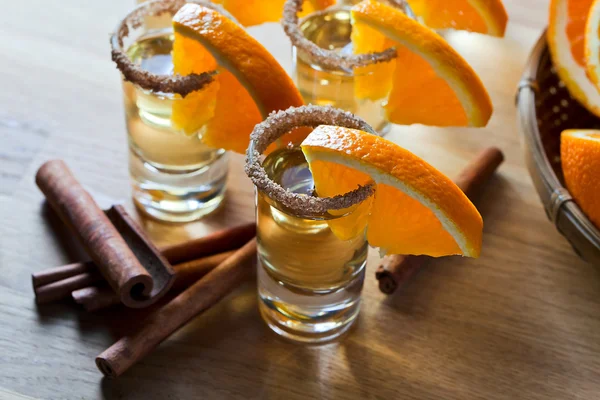 Tequila with orange and cinnamon — Stock Photo, Image