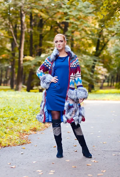 Girl in a knitted coat — Stock Photo, Image