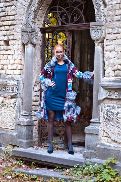 Girl in a knitted coat — Stock Photo, Image