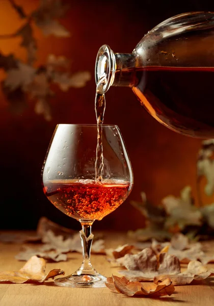 Cognac Poured Glass Bottle Snifter Brandy Old Oak Table Fallen — Stock Photo, Image