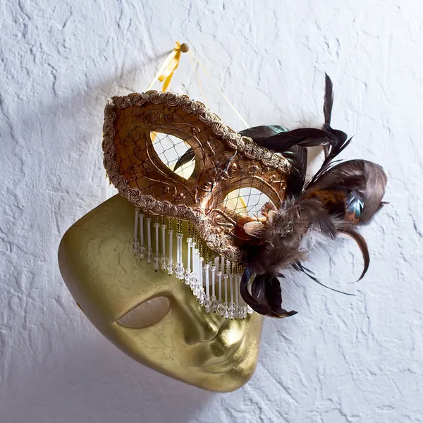 Venetian masks on  old wall — Stock Photo, Image