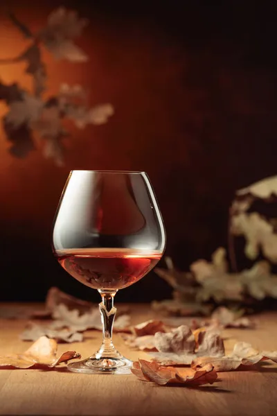 Snifter Brandy Old Oak Table Fallen Oak Leaves Copy Space — Stock Photo, Image