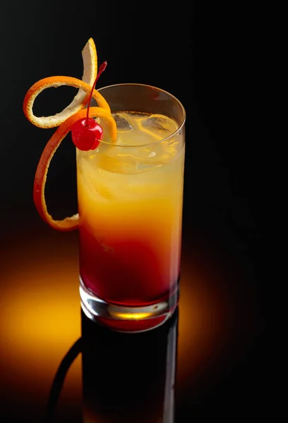 Cocktail Tequila Sunrise Cherry Black Reflective Background — стоковое фото