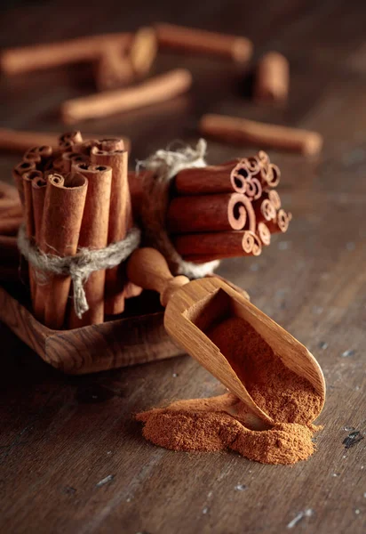 Cinnamon Sticks Small Wooden Spoon Powder Old Wooden Table — Stock Photo, Image