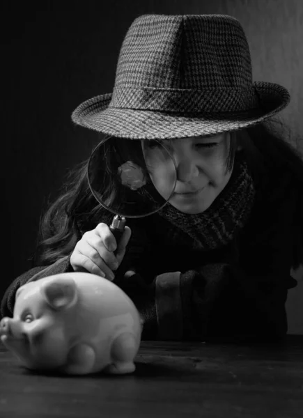 Cute Little Detective Magnifying Glass Looks Piggy Bank Little Girl — Stock Photo, Image