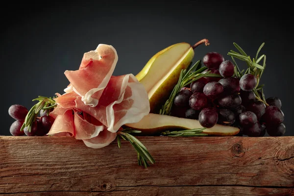 Prosciutto Rosemary Pear Grapes Old Wooden Table — Stock Photo, Image