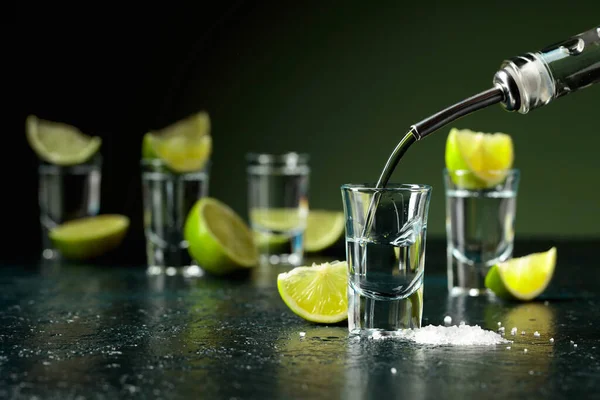 Tequila Poured Glass Tequila Shots Lime Slices Sea Salt — 스톡 사진