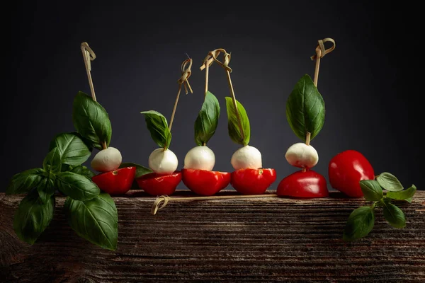 Mozzarella Basil Tomatoes Old Wooden Board Traditional Italian Snack — Foto de Stock