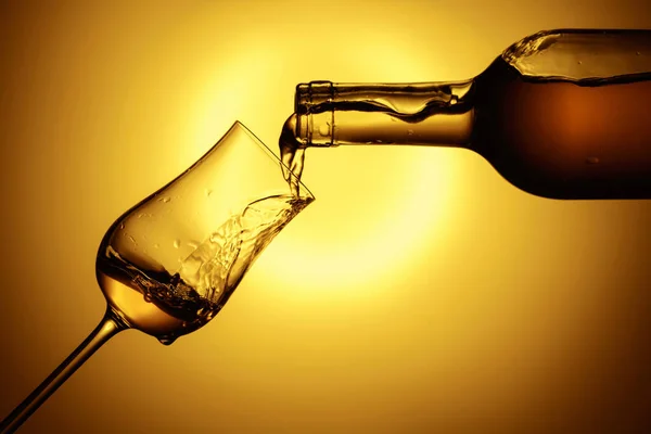 Digestive Tulip Premium Alcohol Yellow Background Drink Poured Bottle Glass —  Fotos de Stock