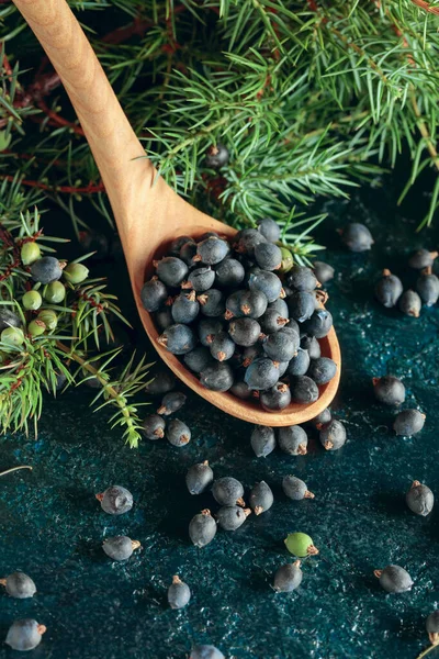 Wooden Spoon Seeds Juniper Old Dark Blue Table — Stock Photo, Image