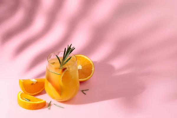 Summer Cocktail Orange Rosemary Ice Drink Pink Background Palm Leaf — 스톡 사진