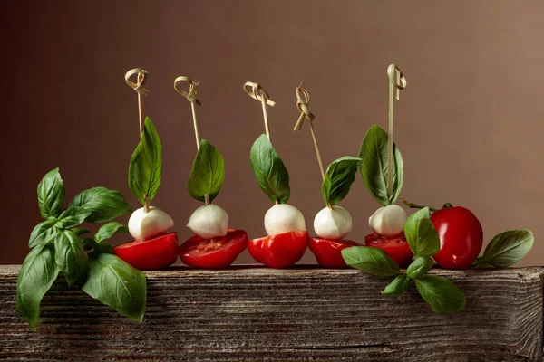 Mozzarella Basil Tomatoes Old Wooden Board Traditional Italian Snack — Foto de Stock