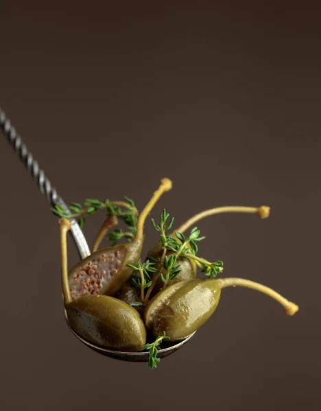 Large Pickled Capers Thyme Spoon Brown Background Copy Space — Stock Photo, Image