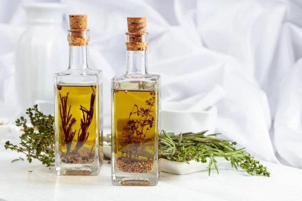 Bottles Olive Oil Spices Herbs White Wooden Table — Stock fotografie