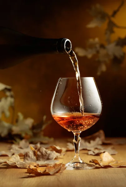 Cognac Poured Glass Bottle Snifter Brandy Old Oak Table Fallen — Stock Photo, Image