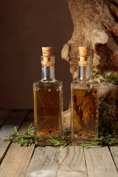 Bottles Olive Oil Herbs Spices Old Wooden Table Background Old — Stok fotoğraf