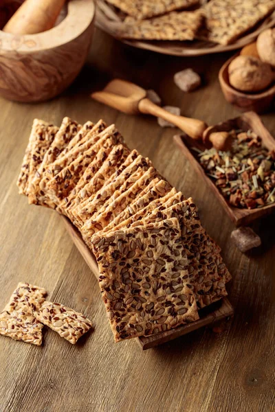 Crispy Crackers Sunflower Seeds Flax Seeds Wooden Table — Stock Photo, Image