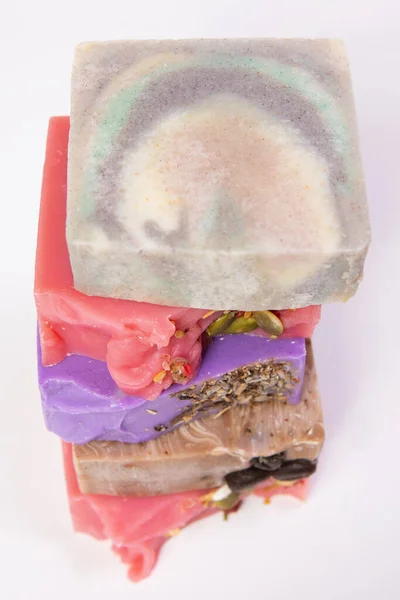 Stack of homemade handmade soap. Cherry cider, sandalwood, coffee and lavender aromas. Small business, organic products, natural ingredients. Top view.
