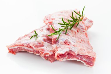 Raw spare ribs with rosemary clipart