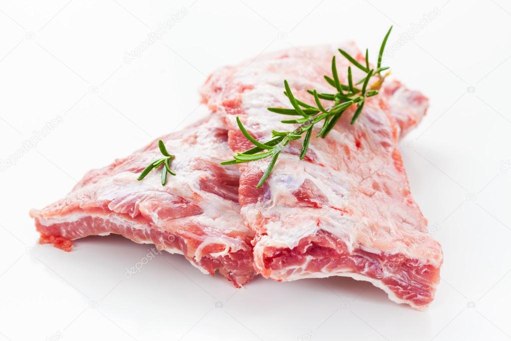 Raw spare ribs with rosemary