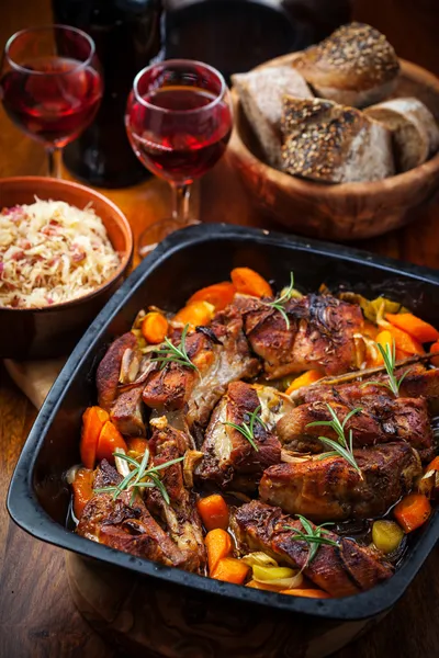 Roasted pork belly on vegetables with sauerkraut — Stock Photo, Image