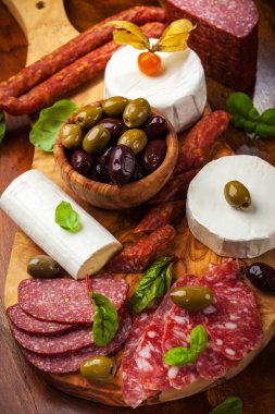 Appetizer catering platter with different meat and cheese products