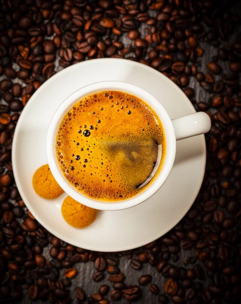 Espresso cup in coffee beans — Stock Photo, Image