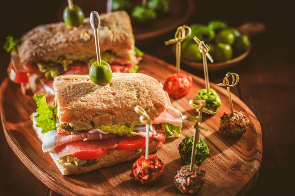 Homemade Ciabatta Sandwich Guacamole Prosciutto Lettuce Tomato Olives — Zdjęcie stockowe