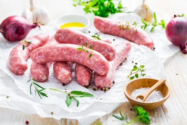 Raw Sausages Prepared Bbq Grill Herbs Onions — стоковое фото