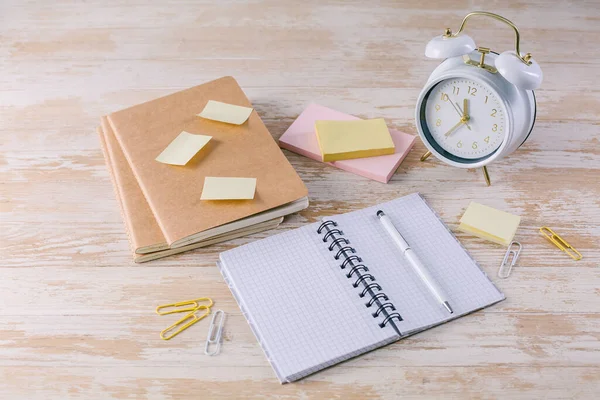 Concept of time management for office and school. Books, notepads with stickers