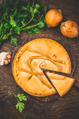 Spanish empanada - traditional meat pie with onions, Spanish cuisine