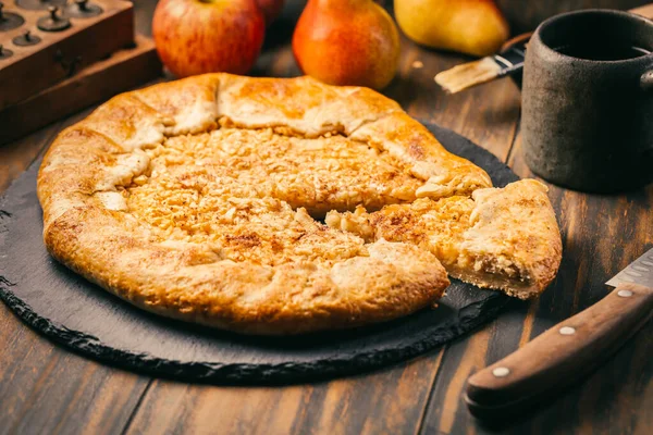 Homemade Galette Pie with Apples and Pears with baking ingredients