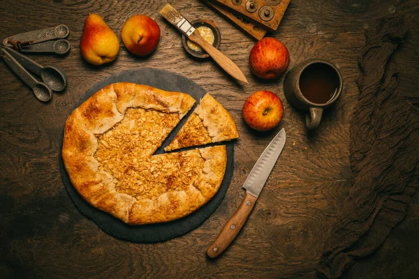 Homemade Galette Pie with Apples and Pears with baking ingredients