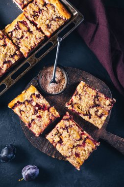 German plum cake (Zwetschgenkuchen) with  yeast dough and crumbles