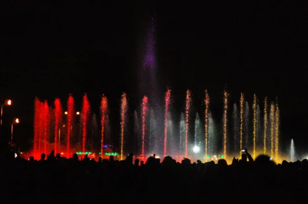 Playing fountains show with fireworks — Stock Photo, Image