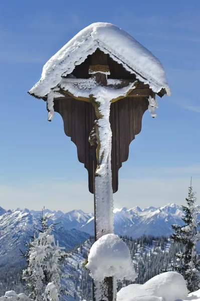 Crucifix at alps mountains — Stock Photo, Image