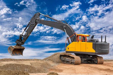 heavy excavator working on construction site clipart