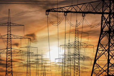 Many electric poles with clouds on sky