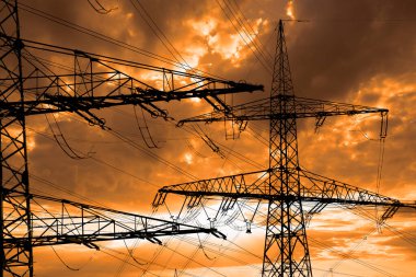Many electric poles with clouds on sky