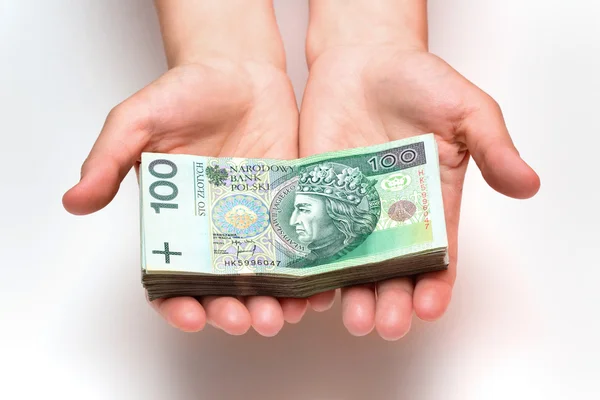 Stack of polish banknotes in hands — Stock Photo, Image