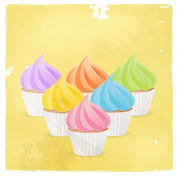 Cupcake with colourful icing — Stock Vector