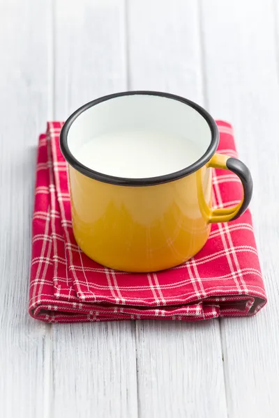 Milk in tin mug — Stock Photo, Image