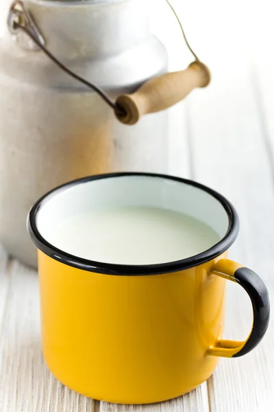 Milk in tin mug — Stock Photo, Image