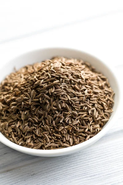 Cumin seeds in ceramic bowl — Stock Photo, Image