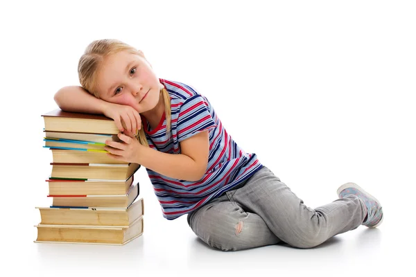 Meisje met een stapel boeken — Stockfoto