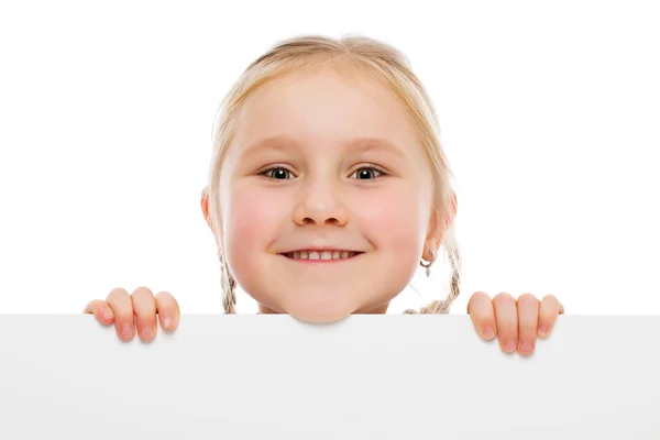 Little girl behind whiteboard — Stock Photo, Image