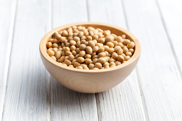 Soy beans in wooden bowl — Stock Photo, Image